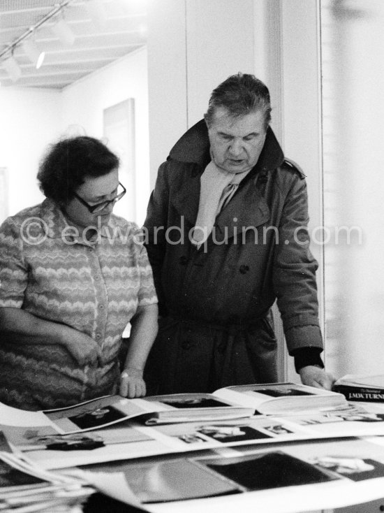Francis Bacon viewing a mockup of a planned book on him at his Reece Mews home. London 1978. - Photo by Edward Quinn