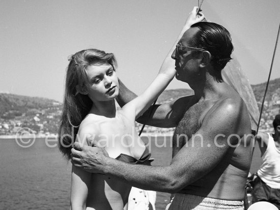 Brigitte Bardot during filming of "Manina, la fille sans voiles". With Film director Willy Rozier. Villefranche harbor 1952. - Photo by Edward Quinn