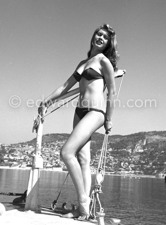 Brigitte Bardot during filming of “Manina, la fille sans voiles”. Villefranche harbor 1952. - Photo by Edward Quinn