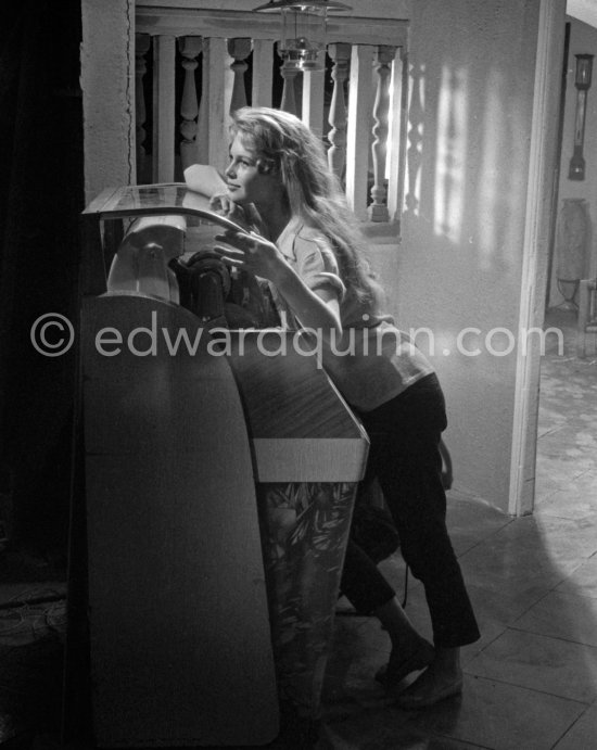 Brigitte Bardot at the juke box during filming of "Et Dieu créa la femme", Studios de la Victorine, Nice 1956 - Photo by Edward Quinn