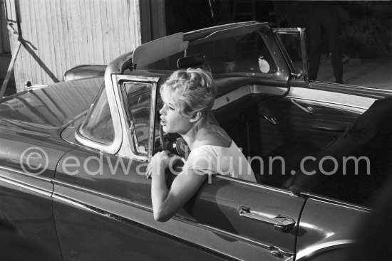 Brigitte Bardot. Studios de la Victorine, during filming of "Voulez-vous danser avec moi?" ("Come dance with me"). Nice 1959. Car: Ford Fairlane 500 Sunliner Convertible 1957. - Photo by Edward Quinn