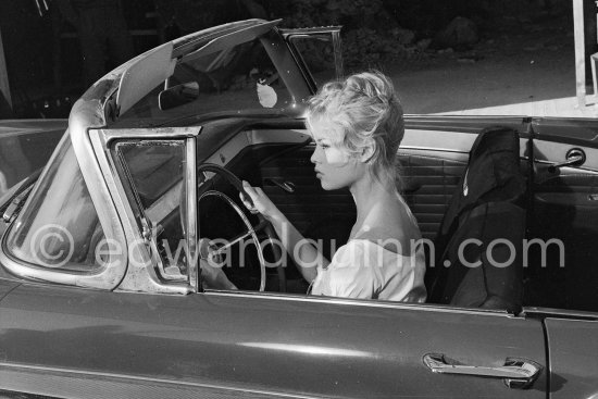 Brigitte Bardot. during filming of "Voulez-vous danser avec moi?" ("Come dance with me"). Studios de la Victorine, Nice 1959. Car: Ford Fairlane 500 Sunliner Convertible 1957. - Photo by Edward Quinn