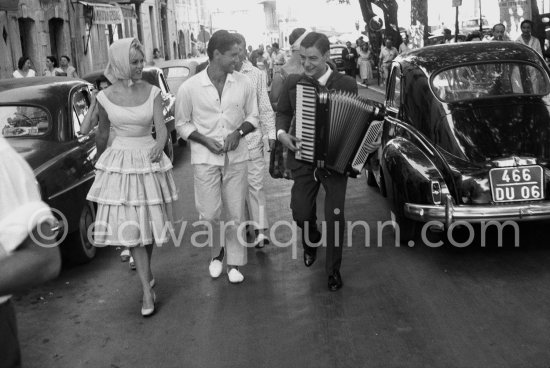 Brigitte Bardot and Sacha Distel. Saint-Tropez 1958. Car: Peugeot 203. - Photo by Edward Quinn