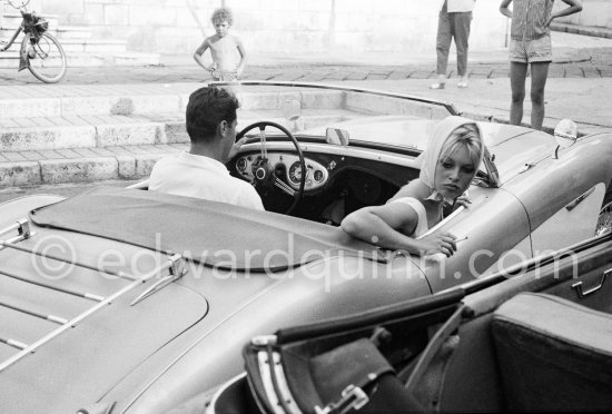 Brigitte Bardot and Sacha Distel going to assist the wedding of jazz musician Moustache. Antibes 1958. Car: Austin-Healey 100/4 1953-55. - Photo by Edward Quinn