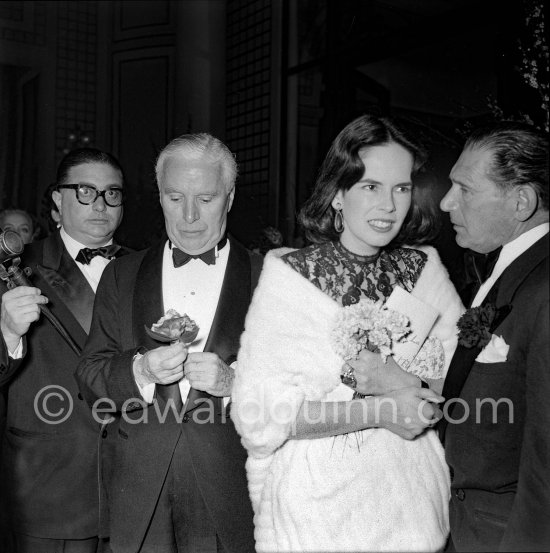 Charlie Chaplin with his wife, Oona, the daughter of the playwrighter Eugene O\'Neill at the Figaro Gala in Cannes 1953. - Photo by Edward Quinn