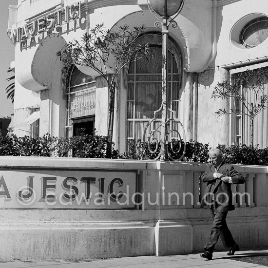 Charlie Chaplin pictured walking past the Hotel Majestic in Cannes, 1953. - Photo by Edward Quinn