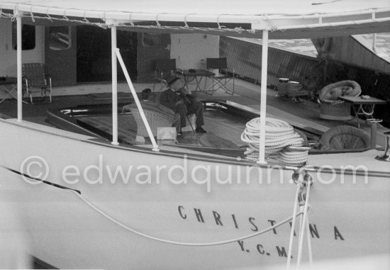 Aristotle Onassis and Sir Winston Churchill. On board Christina, Churchill sitting in lowerable swimming pool. Monaco harbor, about 1957. - Photo by Edward Quinn