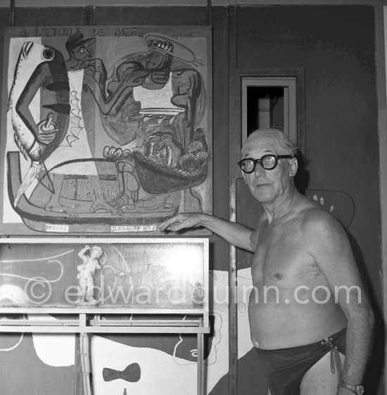 Le Corbusier (Charles-Édouard Jeanneret) with his painting L\'Etoile de Mer at the small restaurant attached to his vacation cabin Le Cabanon, Roquebrune-Cap-Martin 1953. - Photo by Edward Quinn