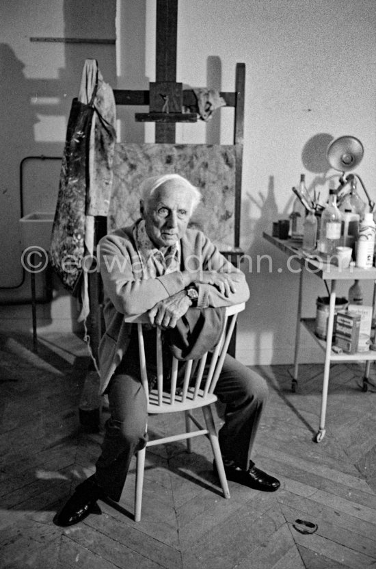 Max Ernst with his smock on the easel. Artwork? Paris 1974 - Photo by Edward Quinn