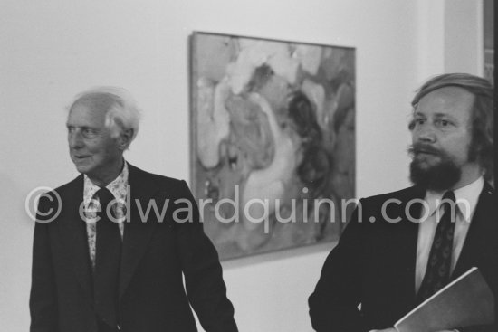 Max Ernst and Werner Spies. Behind them "Philosophie en plein air" by Dorothea Tanning. At the opening of the exhibition "Dorothea Tanning: Oeuvre" (retrospective), Centre National d\'Art Contemporain, Paris, May 28 - July 8, 1974. - Photo by Edward Quinn