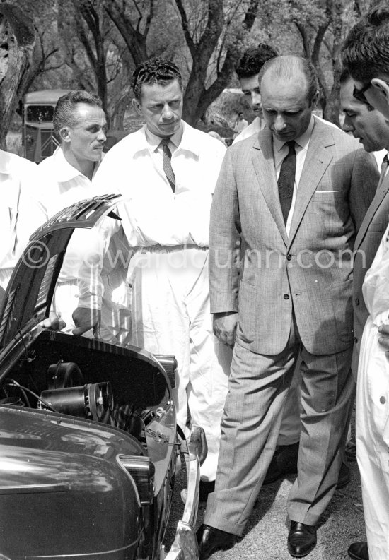 Juan Manuel Fangio and Jean Behra. Presentation of new Vespa 400 1957. Monaco 1957. See www.spiritracerclub.org/vespa-400-la-puce-du-rallye-de-monte-carlo/ - Photo by Edward Quinn