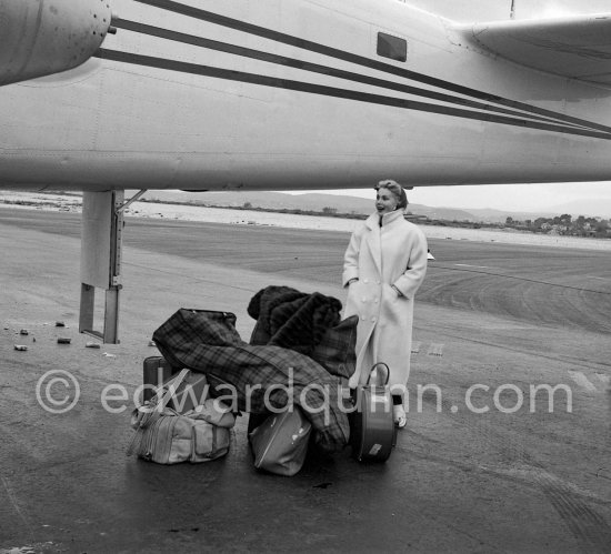 Zsa Zsa Gabor withher luggage in front of the private plane of Porfirio Rubirosa, a converted North American B-25 Mitchell, at Cannes Airport in 1954. North American B-25 Mitchell B-25H-1NA 43-4432 (N10V). See https://bit.ly/2XS08rs. Was as "Berlin Express" in the 1970 movie Catch-22. Today at Eagle Hangar, EAA Aviation Museum, Oshkosh. - Photo by Edward Quinn