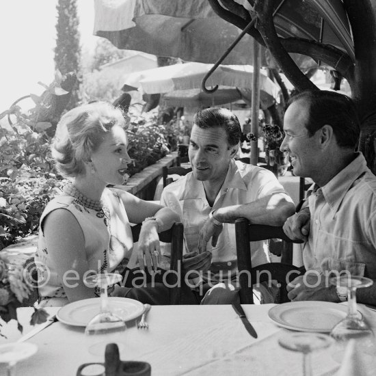 Zsa Zsa Gabor, Porfirio Rubirosa and Earl Blackwell, a society impresario who made his fortune keeping track of celebrities, at the restaurant Colombe d\'Or, Saint-Paul-de-Vence 1953. - Photo by Edward Quinn