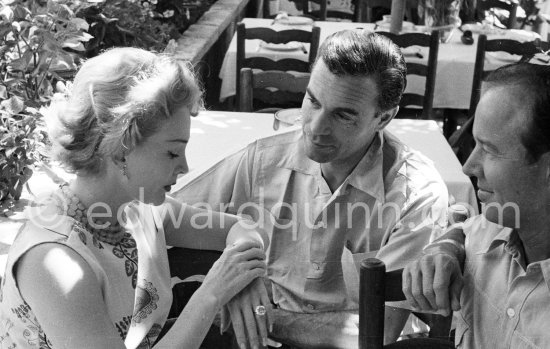 Zsa Zsa Gabor, Porfirio Rubirosa and Earl Blackwell, a society impresario who made his fortune keeping track of celebrities, at the restaurant Colombe d\'Or, Saint-Paul-de-Vence 1953. - Photo by Edward Quinn