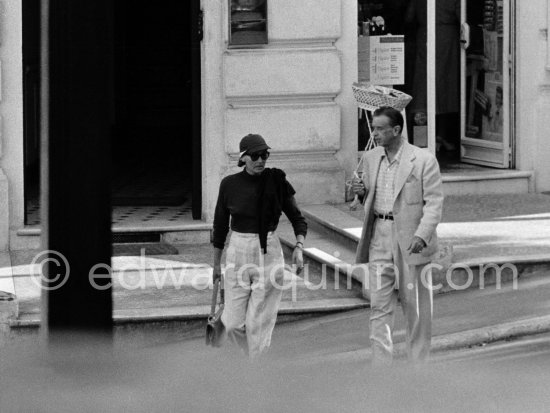 Greta Garbo with American businessman boyfriend George Schlee crossing the Avenue Saint-Michel in Monte Carlo in 1955. - Photo by Edward Quinn
