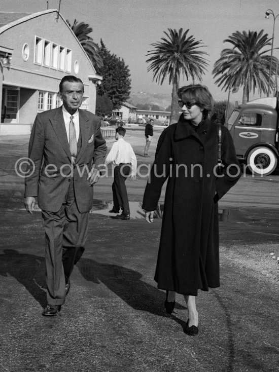 Greta Garbo with American businessman and boyfriend George Schlee (l) arriving at Nice Airport 1956. - Photo by Edward Quinn