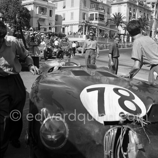 The accident at Sainte-Dévote: Stirling Moss, (78) restarts his Jaguar C-Type XKC 003 but got a black flag for receiving outside help. Monaco Grand Prix 1952, transformed into a race for sports cars. This was a two day event, the Sunday, Prix Monte Carlo, for the up to 2 litres (Prix de Monte Carlo), the Grand Prix, Monday for the bigger engines, (Monaco Grand Prix). The Aston engine of Parnell blows up in the Ste-Devote and aligns his car against the straw bales, Stagnoli brakes too hard and does a double spin. Moss, Jaguar C-Type XKC 003 and Manzon find an obstructed road, spin and end up against the poor Aston, then Hume spins and reverses into the pile. Fortunately nobody gets hurt. - Photo by Edward Quinn