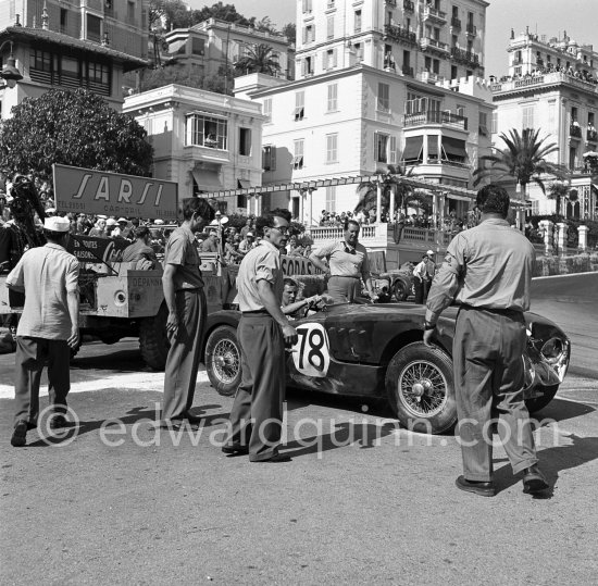 The accident at Sainte-Dévote: Stirling Moss, (78) restarts his Jaguar C-Type XKC 003 but got a black flag for receiving outside help. Monaco Grand Prix 1952, transformed into a race for sports cars. This was a two day event, the Sunday, Prix Monte Carlo, for the up to 2 litres (Prix de Monte Carlo), the Grand Prix, Monday for the bigger engines, (Monaco Grand Prix). The Aston engine of Parnell blows up in the Ste-Devote and aligns his car against the straw bales, Stagnoli brakes too hard and does a double spin. Moss, Jaguar C-Type XKC 003 and Manzon find an obstructed road, spin and end up against the poor Aston, then Hume spins and reverses into the pile. Fortunately nobody gets hurt. - Photo by Edward Quinn
