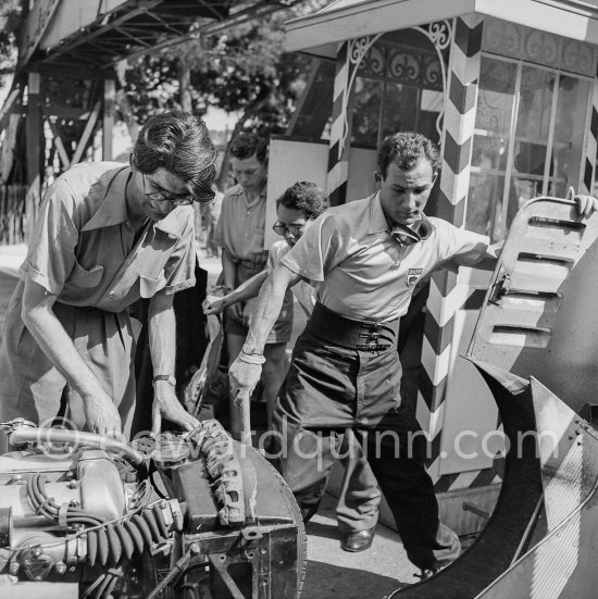 Stirling Moss works on his damaged Jaguar C-Type XKC 003 after the accident at Sainte-Dévote. Monaco Grand Prix 1952, transformed into a race for sports cars. This was a two day event, the Sunday for the up to 2 litres (Prix de Monte Carlo), the Monday for the bigger engines. - Photo by Edward Quinn