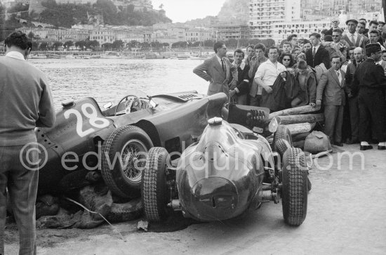 After the race: The cars of Mike Hawthorn, (28) Ferrari-Lancia D50 and Peter Collins, (26) Ferrari 801 in the barriers while Wolfgang von Trips, (24) Ferrari 80I, passes. The incident happend in lap 4 of the 1957 Monaco Grand Prix after leader Stirling Moss "lost" his Vanwall in the chicane. Peter Collins swerved to avoid Moss but hit the wall while Mike Hawthorn rammed Tony Brooks who braked hard to avoid the cars in front of him. - Photo by Edward Quinn