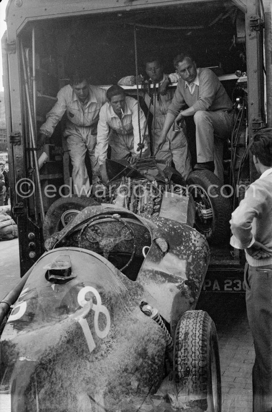 After the race: The crashed Vanwall VW3/V4 of Stirling Moss, beeing hold away after the race. Monaco Grand Prix 1957. - Photo by Edward Quinn