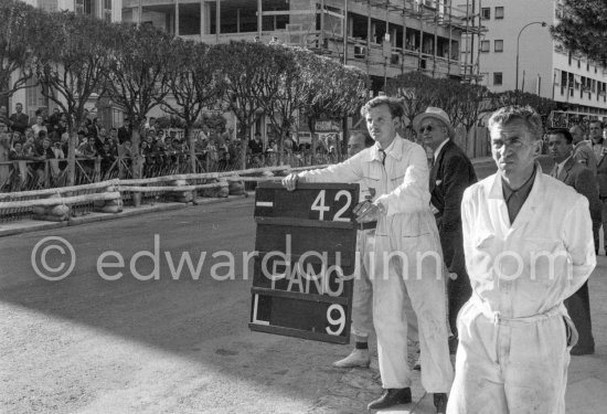 Behind the mechanic Stirling Moss and Tony Vandervell, head of the Vanwall Formula One racing team. Monaco Grand Prix 1957. Monaco Grand Prix 1957. - Photo by Edward Quinn