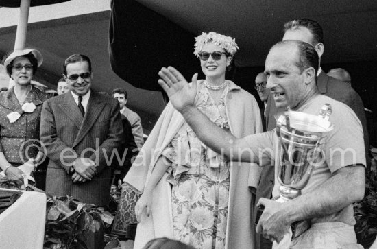 The winner of the race, Juan Manuel Fangio who received the cup of Princess Grace waves to the crowd. Monaco Grand Prix 1957. - Photo by Edward Quinn