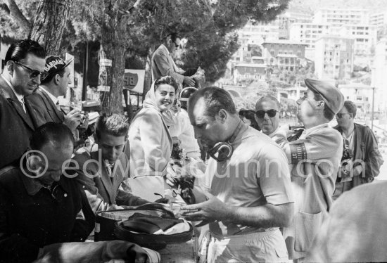 The ex Princess Bira, a South American, is all smiles over the Argentinean Fangio\'s victory. Monaco Grand Prix 1957. - Photo by Edward Quinn