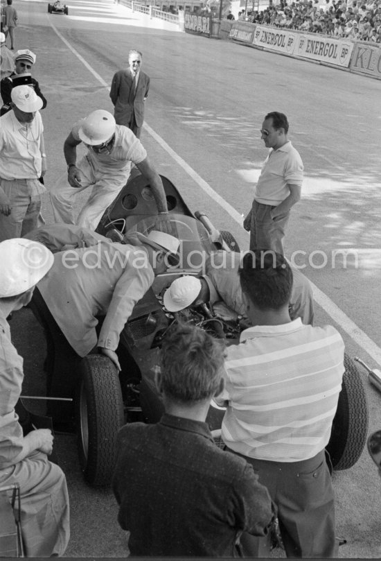 Stirling Moss, (28) Vanwall VW7, stops at the pits with valve problems. Tony Vandervell (white hat), founder of the Vanwall Formula One racing team. Monaco Grand Prix 1958. - Photo by Edward Quinn