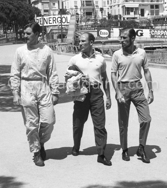 Arriving on the race track Graham Hill, Stirling Moss and Norman Solomon, a close friend of Moss (left to right). Monaco Grand Prix 1960. - Photo by Edward Quinn