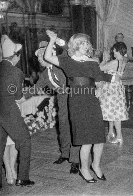 Stirling Moss, winner of the Grand Prix, gets into the party spirit as he dances with Swedish model Helga Mayerhoffer. Gala of Monaco Grand Prix 1960. - Photo by Edward Quinn