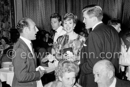 Lance Reventlow congratulates Stirling Moss on his victory. With him his filmstar wife Jill St. John. Gala of Monaco Grand Prix 1960. - Photo by Edward Quinn
