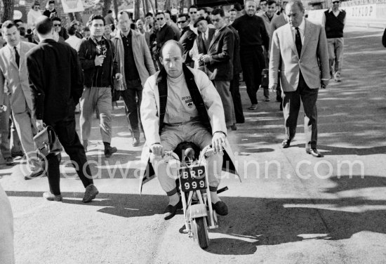 Stirling Moss enjoys riding around with his 1961 Trojan Trobike. Monaco Grand Prix 1961. - Photo by Edward Quinn