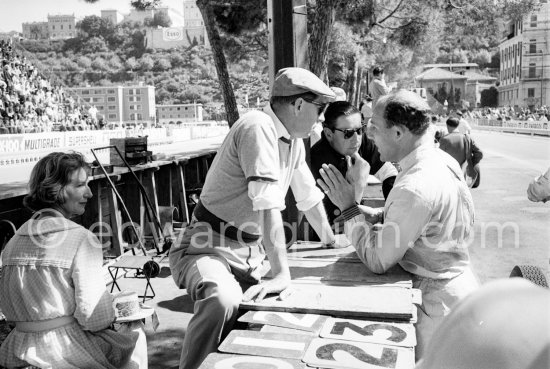Stirling Moss, Rob Walker (hat), A.R.P. (Tony) Rolt who raced cars for Rob Walker in the 1950\'s.  On the left Rob Walker\'s wife, Betty.Monaco Grand Prix 1961. - Photo by Edward Quinn