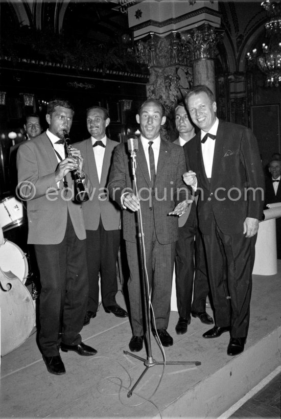 Asnatch of song from Stirling Moss as he joins in with Louis Frosio\'s (right) danceband in a Monaco nightspot after the Monaco Grand Prix 1961. - Photo by Edward Quinn