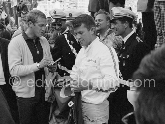 Steve McQueen, signing autographs for policemen, and Ronnie Bucknum (USA, Honda 272). Monaco GP 1965. - Photo by Edward Quinn