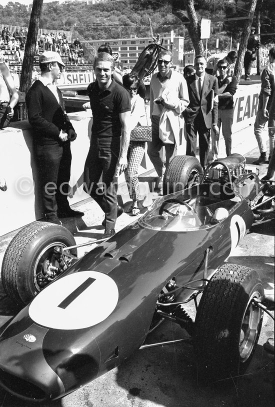 Steve McQueen and his wife Neile, the car of Jack Brabham, (1) Brabham BT11 Climax. Monaco Grand Prix 1965. - Photo by Edward Quinn