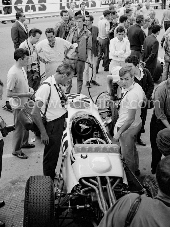 Jack Brabham is interested in Ronnie Bucknum\'s Honda RA272. Monaco Grand Prix 1965. - Photo by Edward Quinn