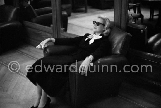 Grace Kelly relaxing in the lobby of the Carlton Hotel during the Cannes Film Festival 1955. - Photo by Edward Quinn