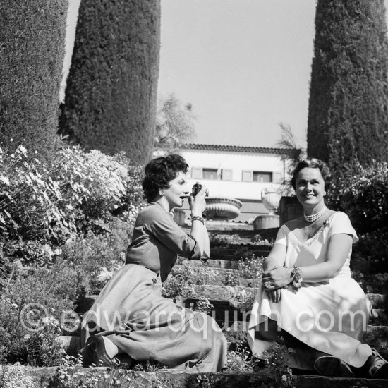 Gina Lollobrigida taking photos of the Begum Aga Khan in front of Villa Yakymour. Cannes 1955. - Photo by Edward Quinn