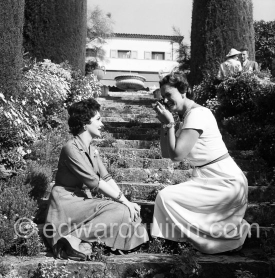 Begum Aga Khan taking photos with a Leica of Gina Lollobrigida at her Villa Yakymour. Cannes 1955. - Photo by Edward Quinn