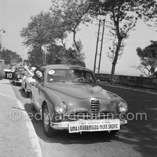 Gina Lollobrigida and husband Milko Skofic arrive well announced for the 2. Rallye automobilistico del cinema. Cannes 1955. Car: Alfa Romeo 1900 Super (1954/1955) - Photo by Edward Quinn