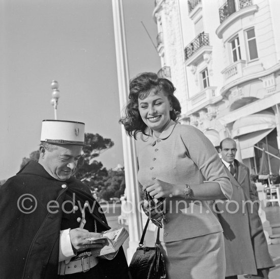 The Police of Nice is interested in Sophia Loren. Promenade des Anglais, in front of Hotel Negresco, Nice 1957. - Photo by Edward Quinn