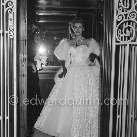 Sophia Loren getting out of the elevator in the Carlton Hotel, ready to face the photographers. Cannes Film Festival 27 April 1955. - Photo by Edward Quinn