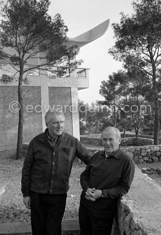 Joan Miró and Aimé Maeght in the gardens of the Fondation Maeght. Saint-Paul-de-Vence 1964. - Photo by Edward Quinn
