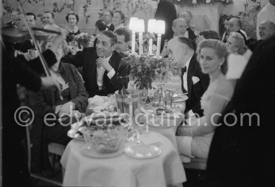 Aristotle Onassis, his guest Mrs Jacks, with on the right Tina Onassis and Mr. Jacks. "Bal de la Rose" gala dinner at the International Sporting Club in Monte Carlo, 1956. - Photo by Edward Quinn