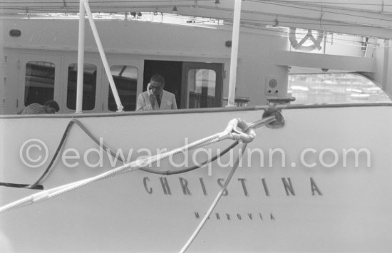 Aristotle Onassis on board his yacht Christina. Monaco harbor 1955. - Photo by Edward Quinn