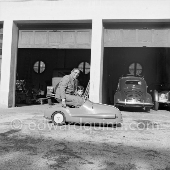 Aristotle and his son Alexander Onassis. Château de la Croë. Cap d\'Antibes 1954. Car in garage: Renault 4CV - Photo by Edward Quinn