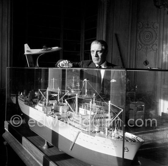 Greek shipping tycoon Aristotle Onassis with the model of one of his first large ships at his office at Olympic Maritime in Monte Carlo 1955. - Photo by Edward Quinn