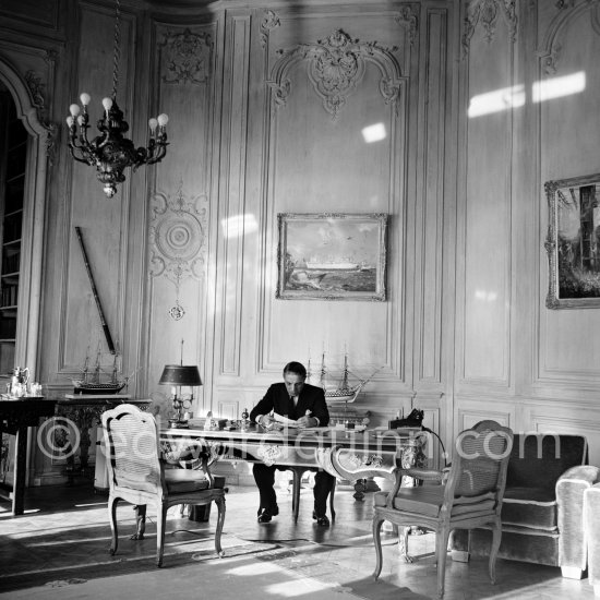 Aristotle Onassis at his office at Olympic Maritime in Monte Carlo. Onassis became the most important shareholder of the Casino. He declared: "I am ready, I am going to save the Principality." Monte Carlo 1955. - Photo by Edward Quinn